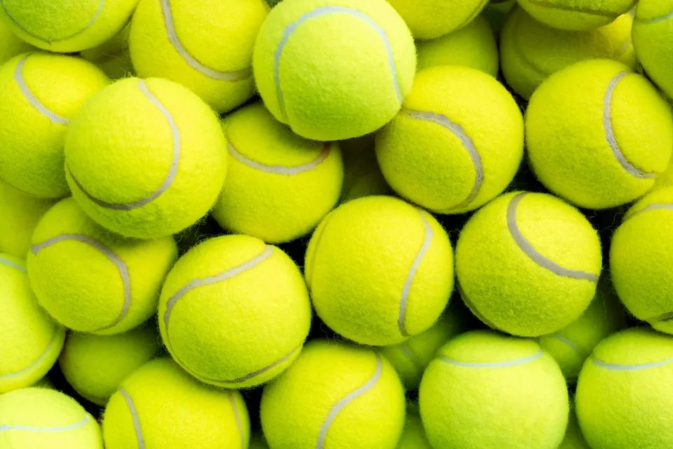 Close-up of bright yellow tennis balls